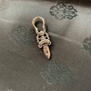 Chrome hearts silver dagger charm.